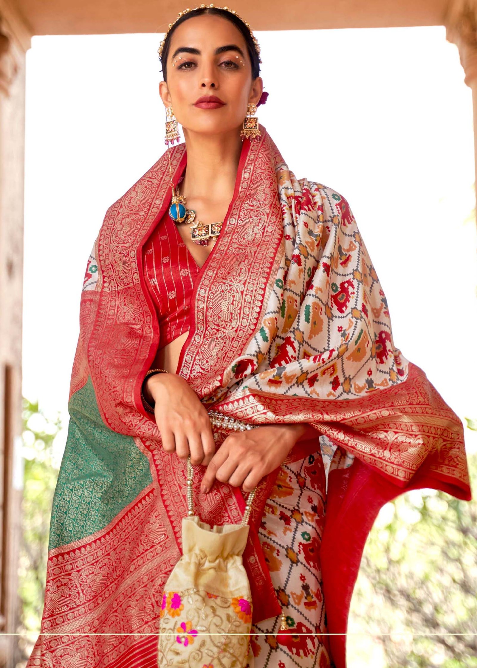 White Patan Patola Double Ikat Saree with Parrot Motif – WeaveinIndia