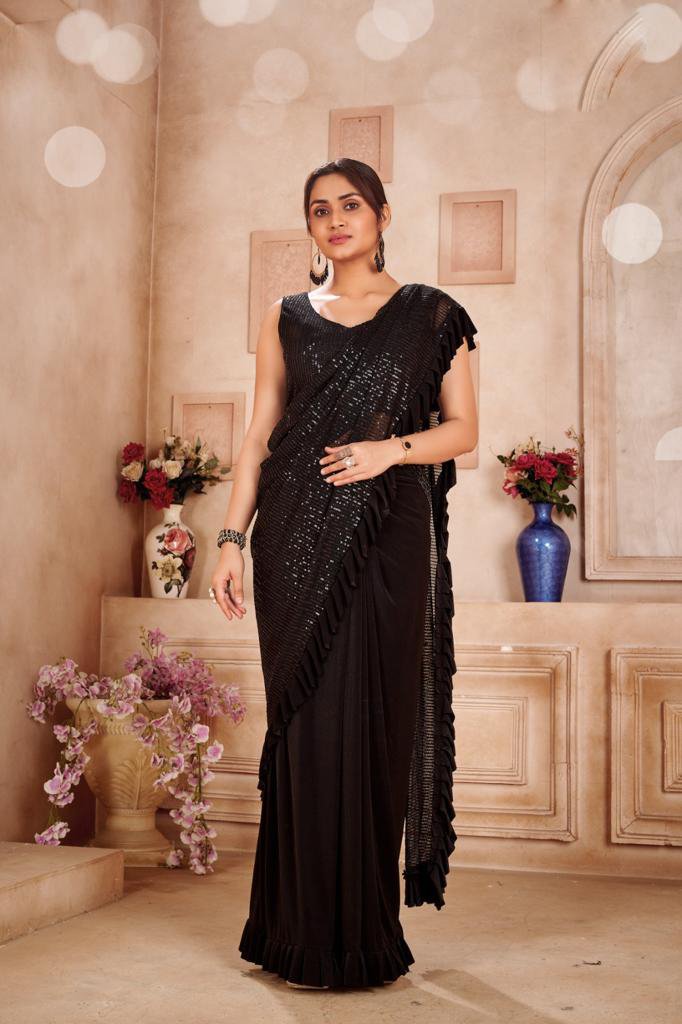 This is such a beautiful saree and it looks so shabby on her, like it's  just wrapped around and the big pearl earrings just don't go ughh, what a  waste of opportunity,